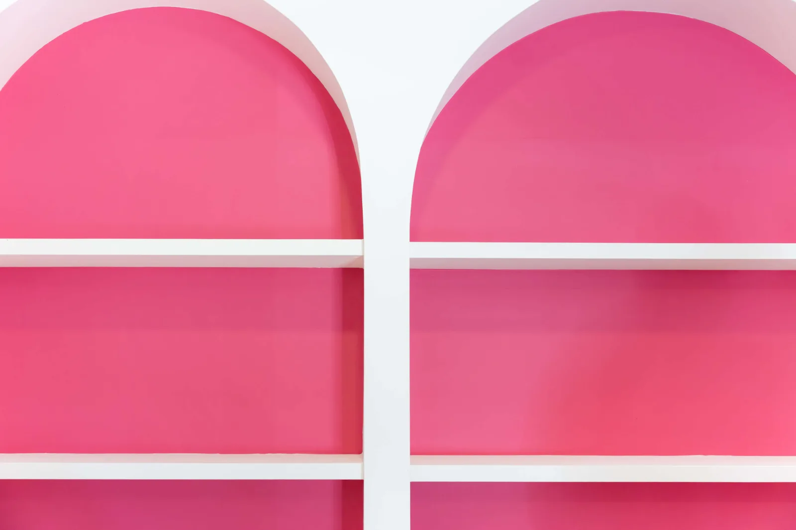 The pink arched shelving